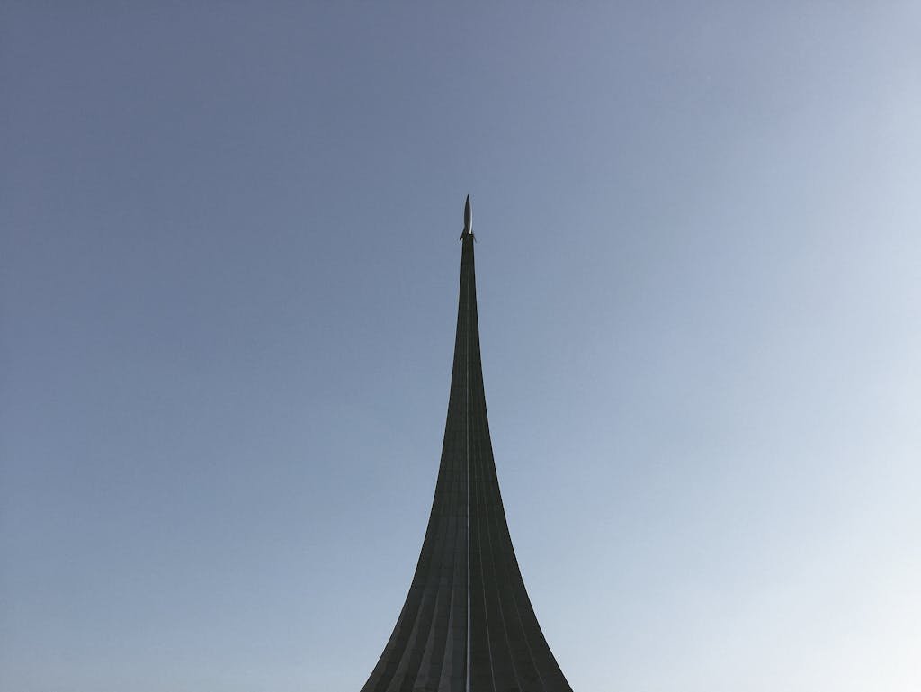 The Space Conquerors Monument under a clear blue sky in Moscow, Russia.